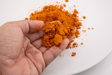 Golden Touch of Turmeric: Spice in Hand for Flavorful Curry 