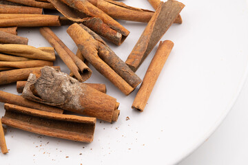 This image captures the warm, rustic charm of cinnamon sticks, showcasing their natural textures and rich, brown hues. 