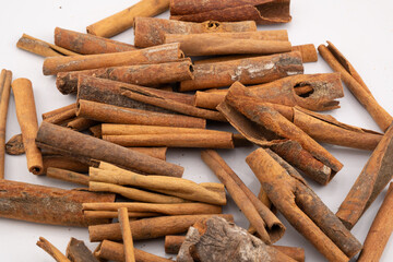 This image captures the warm, rustic charm of cinnamon sticks, showcasing their natural textures and rich, brown hues. 