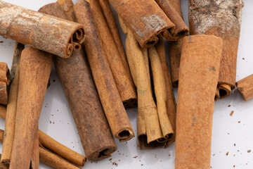 This image captures the warm, rustic charm of cinnamon sticks, showcasing their natural textures and rich, brown hues. 