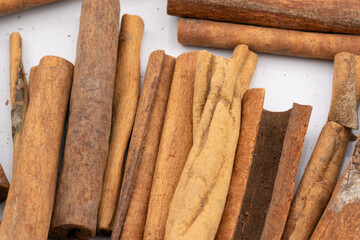 This image captures the warm, rustic charm of cinnamon sticks, showcasing their natural textures and rich, brown hues. 