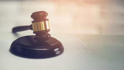 Judgment with a gavel in court, indicating judgment.