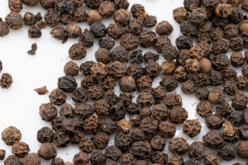 Capture the intense aroma and bold flavor with this detailed close-up of black peppercorns. 