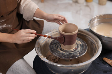 Hobby and craft. Woman making pottery indoors, closeup