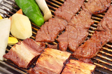 Korean Grilled Pork Ribs with Vegetables on Barbecue Grill