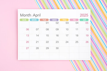 April 2025 calendar page on pink and rainbow background.