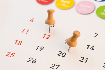 calendar with a red pushpin