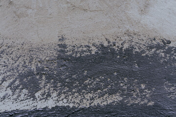 Dirty wall background with rough scratches of black paint