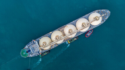 LNG (Liquified Natural Gas) tanker anchored in Gas terminal gas tanks for storage. Oil Crude Gas...