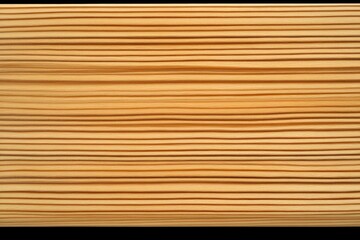 Close-up view of a light brown wood surface with numerous parallel lines, showcasing its fine texture and natural grain.