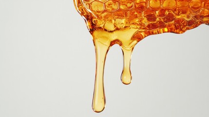 Golden Honey Dripping from Honeycomb with Soft Lighting Background