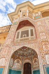 An amazing view of the decorated gateway at Amber Fort in Jaipur, India, captured in an artistic photo, showcasing the beauty of the world.