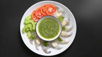 shrimp in fish sauce with Thai spicy seafood dipping sauce on white plate