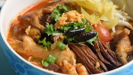 rice vermicelli with northern thai curry sauce on blue background