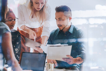 Business people working with a digital tablet in a meeting