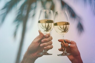 Couple enjoying a glass of wine by the beach
