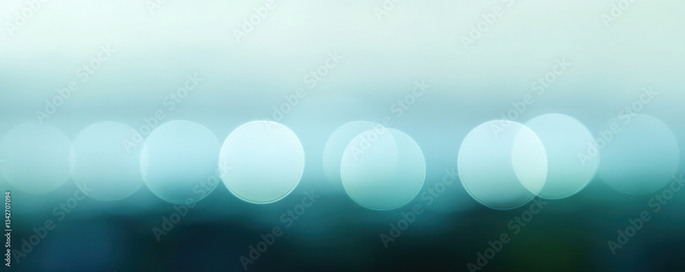 Aufkleber the image is a blurry blue background with a series of blue circles. the circles are of varying size