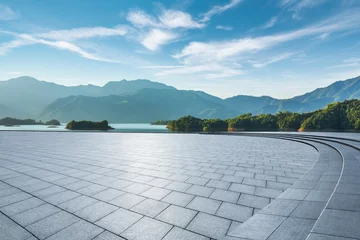 Selbstklebende Fototapeten Empty square floor and beautiful lake with mountain natural landscape in summer © ABCDstock