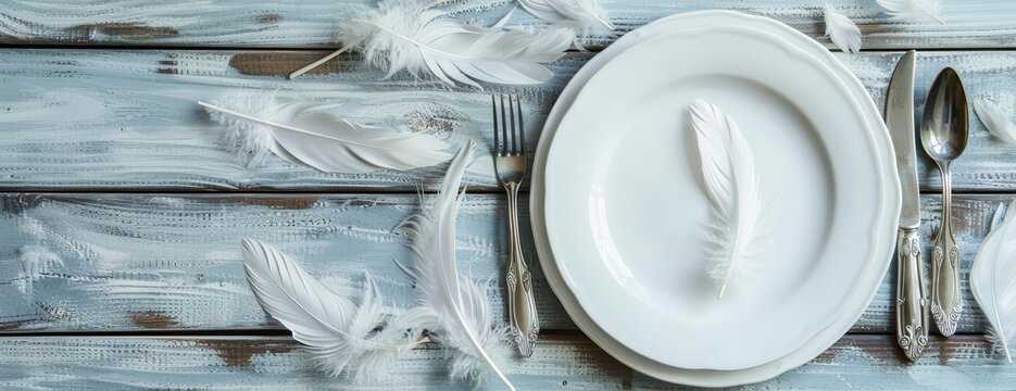 White Feathers and Elegant Table Setting on Rustic Wooden Table