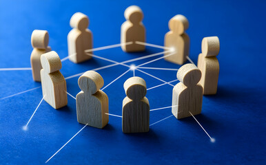 Obraz premium Wooden Figures Representing Social Networks On A Blue Background With Connections And Lines Representing Relationships And Interactions. Figures On Blue Background Showing