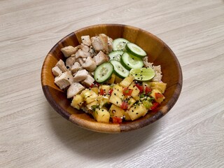 Healthy food. Healthy bowl. Chicken rice with pineapples and cucumbers mixed salad 