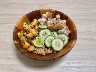 Healthy food. Healthy bowl. Chicken rice with pineapples and cucumbers mixed salad 