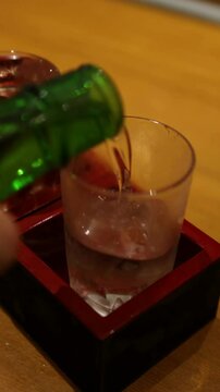 Pouring Sake into Glass