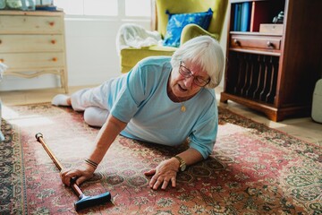 Elderly woman have accident on floor. Senior woman in distress, needs help. Caucasian woman, home setting, seeking assistance. Safety for elderly woman. Elderly woman in accident in home.