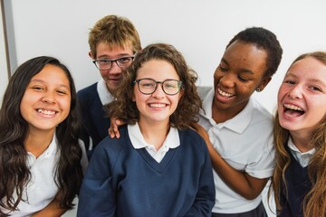 Group of diverse students smiling in school uniforms. Happy students, diverse backgrounds, school...