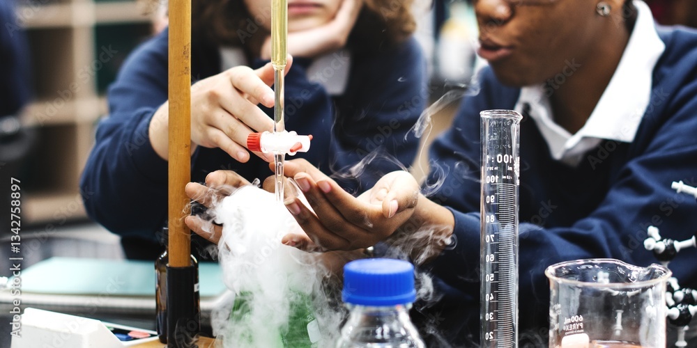 Fototapete Students in science lab conduct experiment. Diverse students study science in school lab. Students focus on science experiment at school. Diverse students in science class conduct experiment