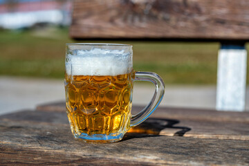 Glass of beer on a bench