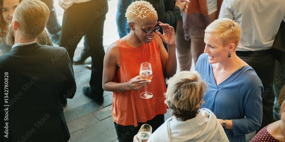 Poster Diverse group of people socializing at a casual event, enjoying drinks and conversation in a lively atmosphere, with a focus on connection and networking. Diverse people socializing in business event