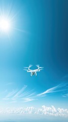 Drone Flying in Blue Sky Over Clouds with Bright Sunlight
