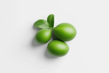 Fresh, vibrant green limes arranged with leaves