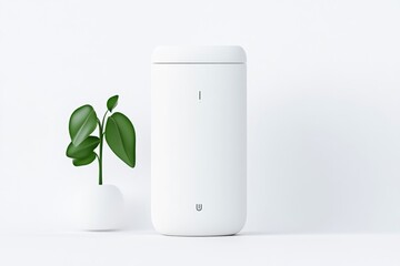 Modern white portable device next to a small plant