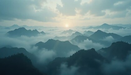 Ethereal mountain landscape veiled in mist, kissed by the soft glow of the rising sun
