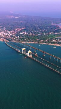 wide-angle drone view of pamban island village with boats and ocean