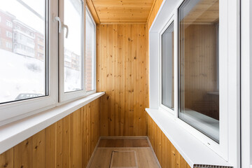 the balcony of an apartment on the upper floors of an apartment building