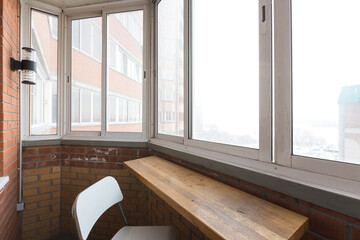 the balcony of an apartment on the upper floors of an apartment building