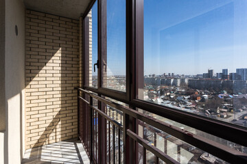 the balcony of an apartment on the upper floors of an apartment building