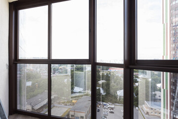 Fototapeta premium the balcony of an apartment on the upper floors of an apartment building