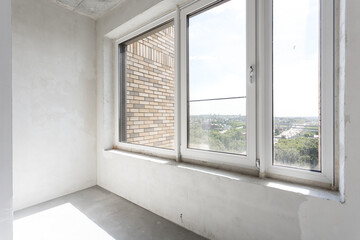 Fototapeta premium the balcony of an apartment on the upper floors of an apartment building
