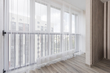 Fototapeta premium the balcony of an apartment on the upper floors of an apartment building