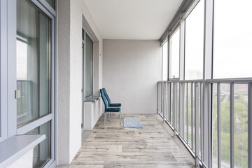 the balcony of an apartment on the upper floors of an apartment building