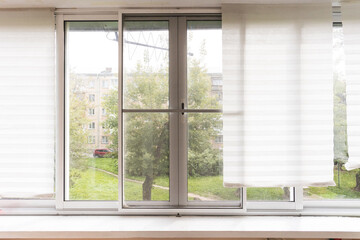 the balcony of an apartment on the upper floors of an apartment building