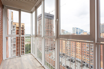 the balcony of an apartment on the upper floors of an apartment building