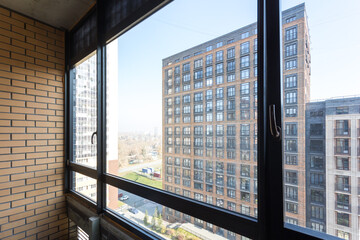 the balcony of an apartment on the upper floors of an apartment building