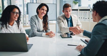 Handshake, finance or business people in accounting meeting for planning, charts or capital growth. Partnership, deal agreement or financial advisor shaking hands with investor, graphs or directors