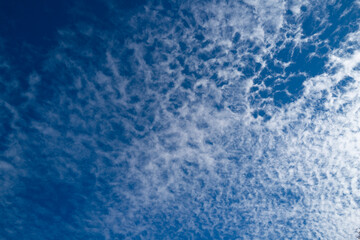 Cloudy skies. Cumulus clouds in sky. Cloud wallpaper. Sky background. Cloudy sky with sunlight. White clouds wallpaper. Blue sky and white clouds background. Idyllic fluffy clouds.