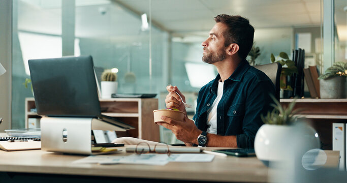 Man, creative and thinking with laptop on lunch break for meal, contemplating or decision at office. Male person, employee or designer with wonder, food or computer for planning or snack at workplace